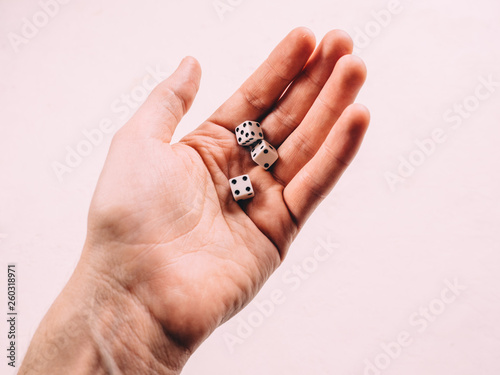 Classic play board game dices in hand. Toning