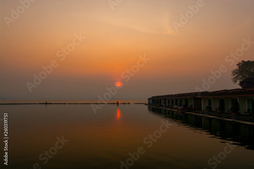 The morning sky looks at the sunrise with a floating resort with a peaceful environment.