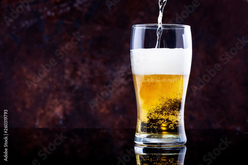 Wallpaper Mural glass of beer with foam on a dark background Torontodigital.ca