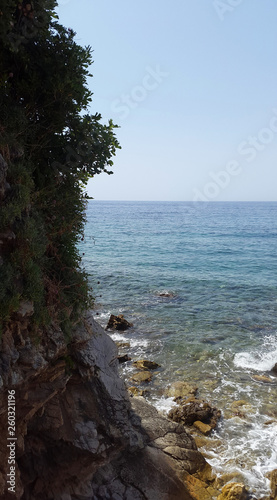 aquamarine water in bay near Budva and stones - Montenegro