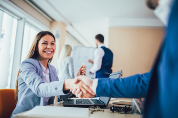 Close-up of business people handshaking