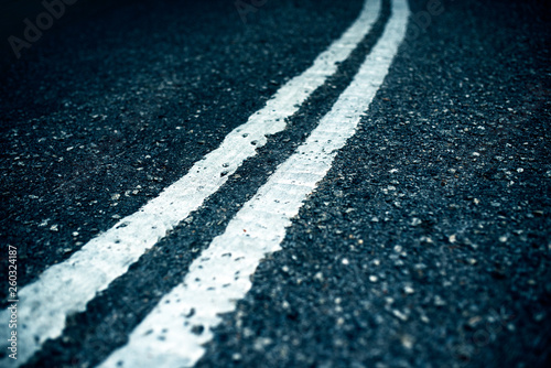 Fotografie two white stripes in the middle of the road