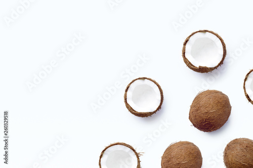 Template with ripe coconuts on white background. From top view. Banner. Copy space