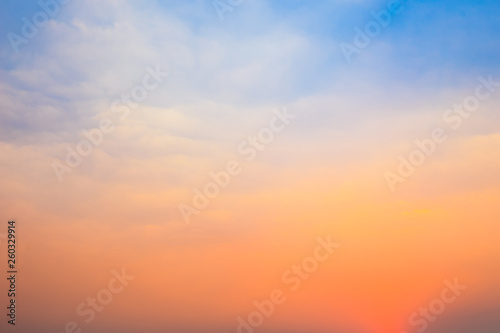Beautiful natural background of twilight blue and orange sky with cloud in morning and evening time before sunrise or after sunset.