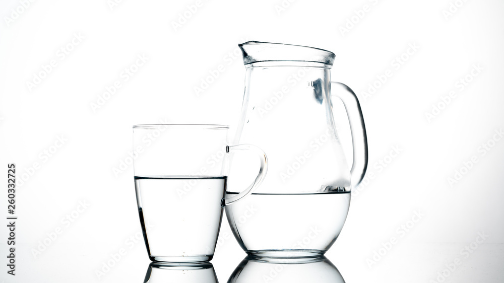 Jug and glass of water on white background Jug and glass of water on white background