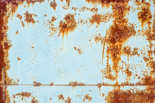Texture of rusty metal, painted white which became orange spots from rust. Horizontal texture of paint on rustic steel sheets photo