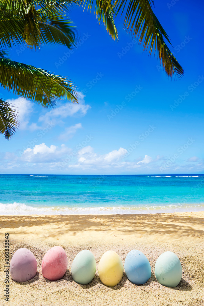 Happy easter lettering background with eggs on the sandy beach Happy easter lettering background with eggs on the sandy beach