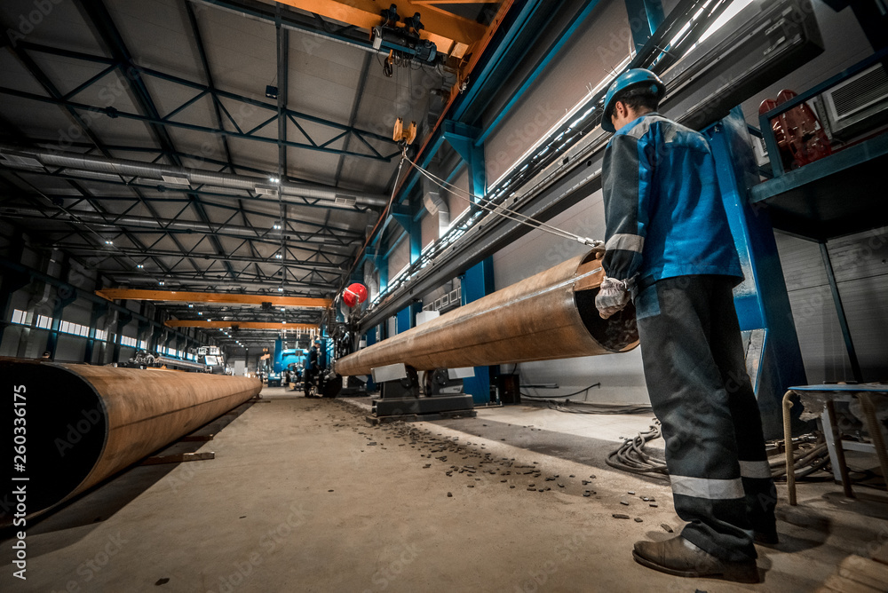 Fototapeta premium man welds at the factory