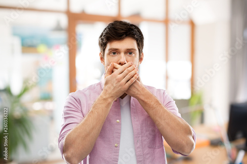 фотографія emotion, expression and people concept - shocked and speechless young man coveri