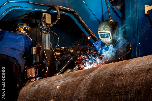 man welds at the factory