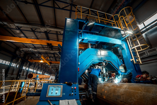 man welds at the factory