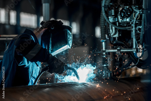 man welds at the factory