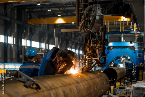 man welds at the factory
