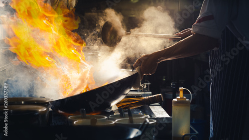 Chef stir fry in wok photo