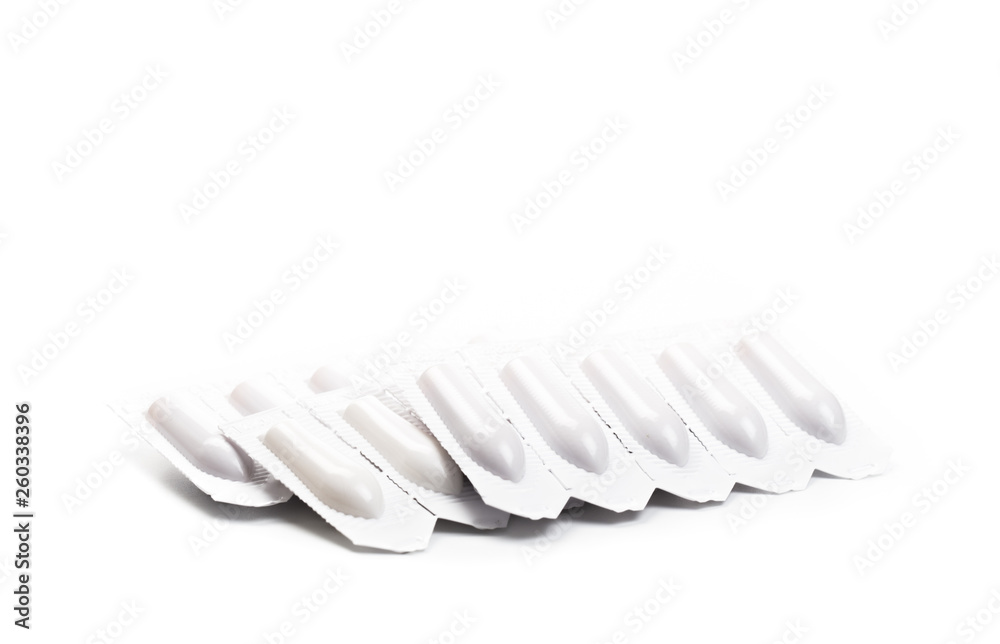 plastic packs of suppositories on white background plastic packs of suppositories on white background