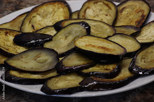 fried eggplant with sunflower oil. thinly sliced and toasted, with a Golden crust.laid out on a plate for stuffing. fast and delicious food. handmade, homemade food