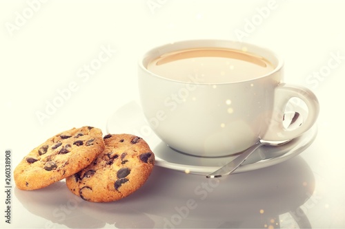 Cup of tea with cookies over  background