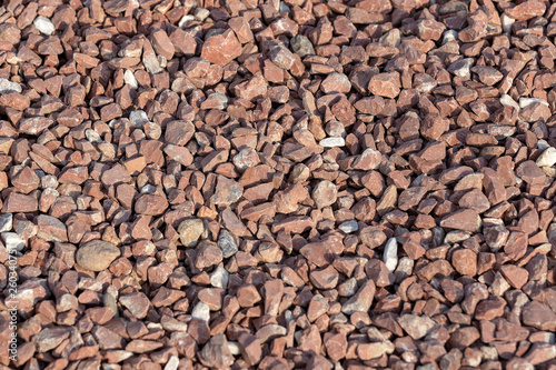 Red Brown Gravel or Soil Texture Background for Design. Real gravel texture background and small stone on ground