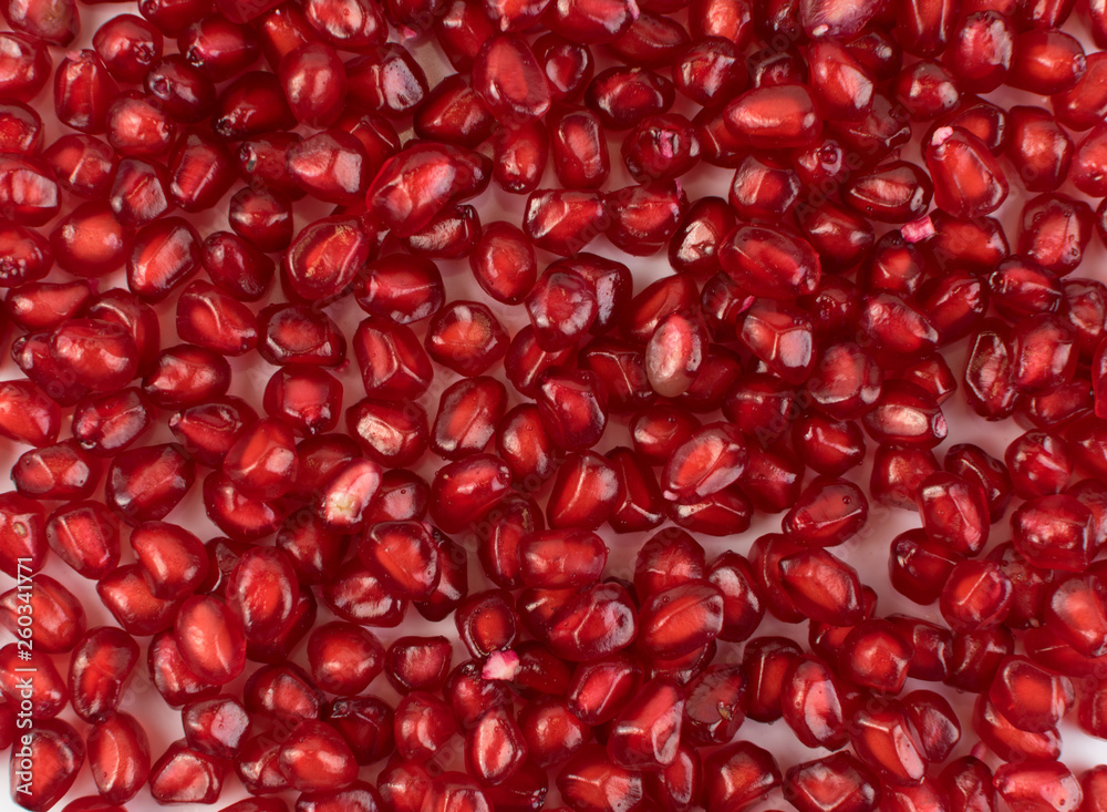 Scattered Pomegranate Seeds Texture on White Background Scattered Pomegranate Seeds Texture on White Background