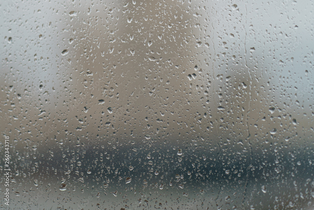 Water drops on the window glass. Macro image of water texture on clear glass Water drops on the window glass. Macro image of water texture on clear glass