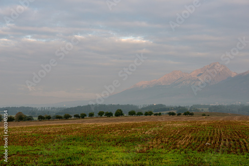 cloudy and foggy sunrise over slovakian landscape in autumn