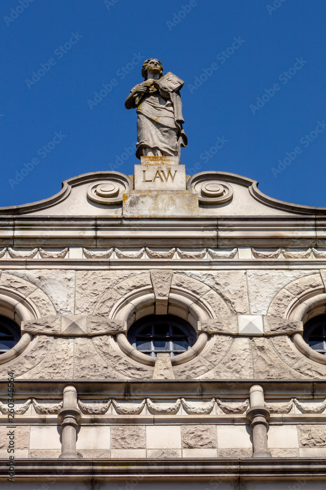 Law Statue on Cornice of building