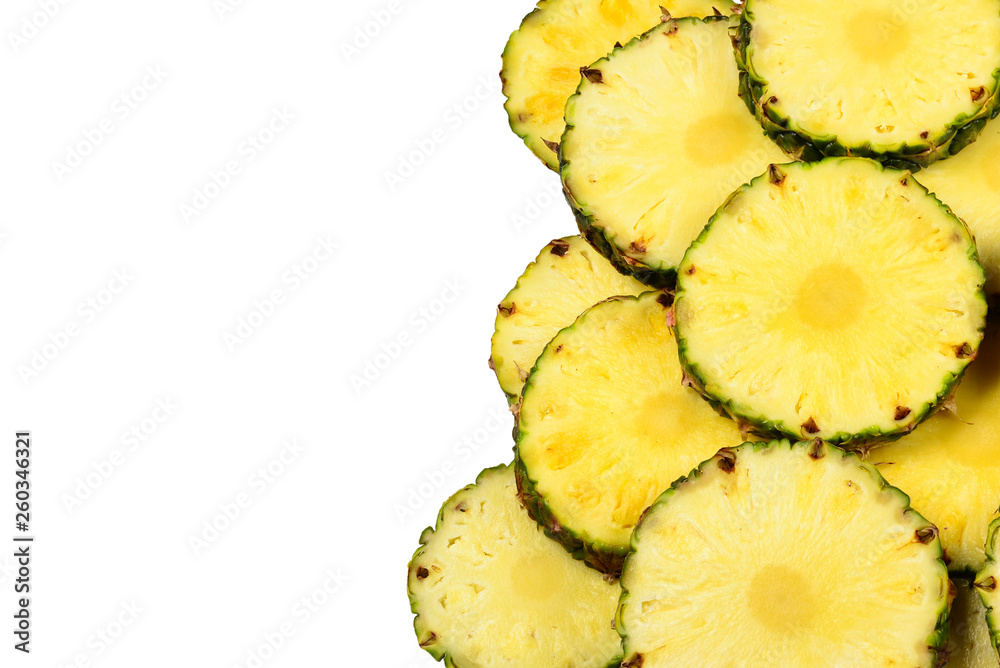 Pineapple juicy yellow slices background. Top view.