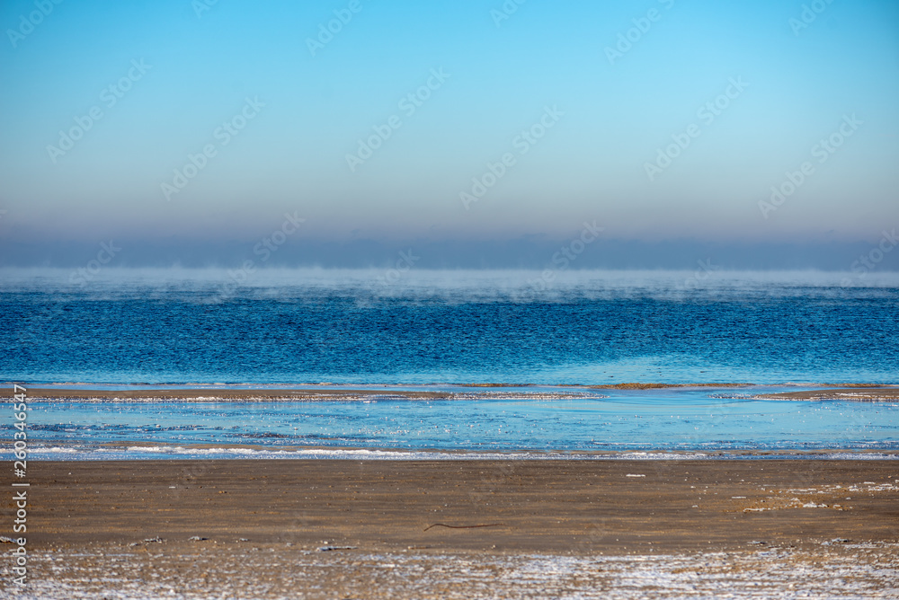 frozen sea beach in winter with low snow coverage frozen sea beach in winter with low snow coverage