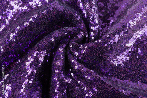 lilac fabric with sequins, fabric for sewing clothes, laid out with soft folds