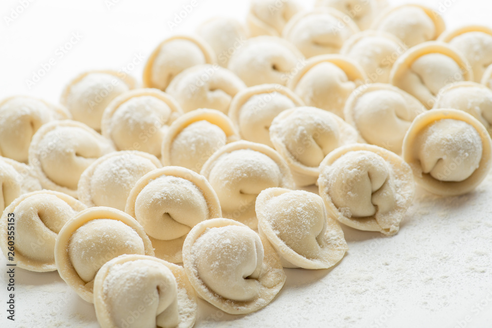 rows of frozen ravioli on a white background. Lots of Isolated Dumplings rows of frozen ravioli on a white background. Lots of Isolated Dumplings