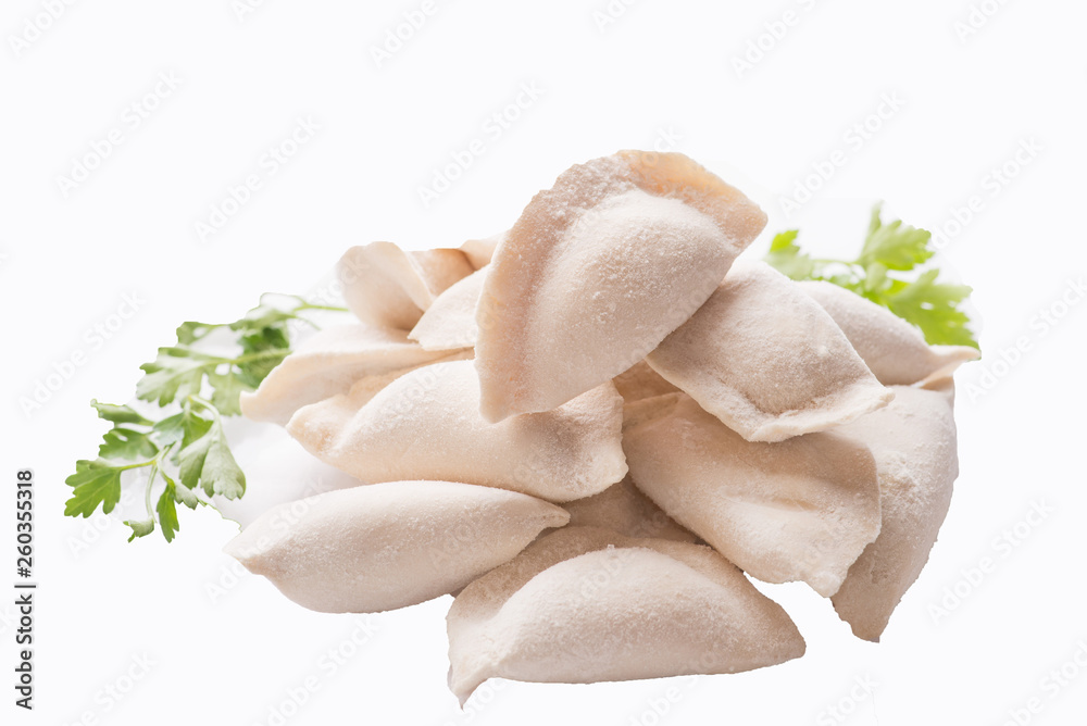 Fototapeta premium heap of frozen dumplings on a white background. Isolated Dumplings