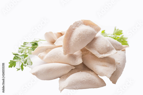 heap of frozen dumplings on a white background. Isolated Dumplings photo