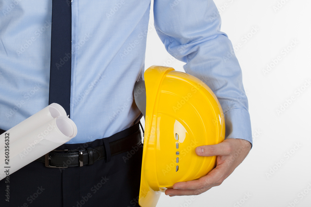 Close up of architect holding helmet and blueprints.