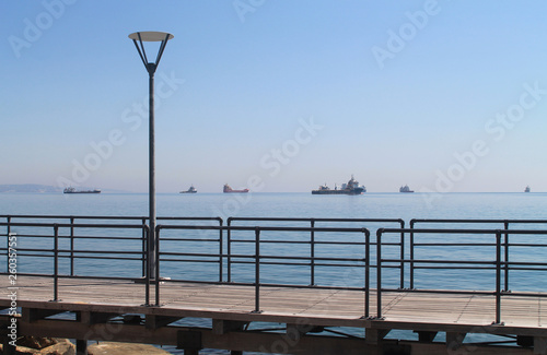 Seaside pathway with street lamp