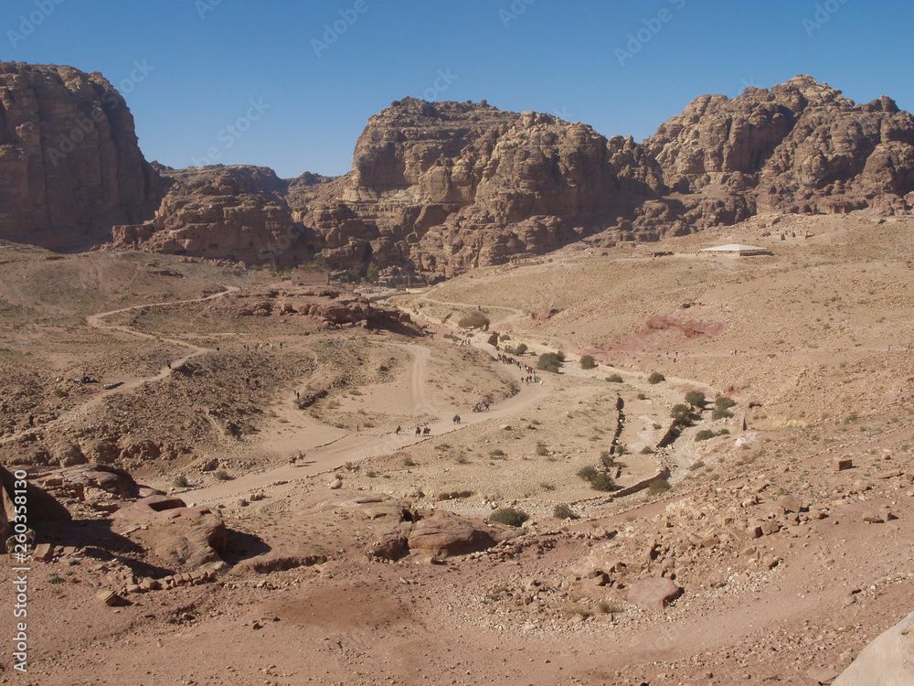 Petra; Raqmu - historic ruins of the ancient, rock city of the Nabatean Arabians. It is located in southwestern Jordan. It is also known as the rose-red city. UNESCO World Heritage list. Petra; Raqmu - historic ruins of the ancient, rock city of the Nabatean Arabians. It is located in southwestern Jordan. It is also known as the rose-red city. UNESCO World Heritage list.