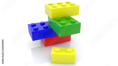 One small toy brick near four toy bricks in various colors