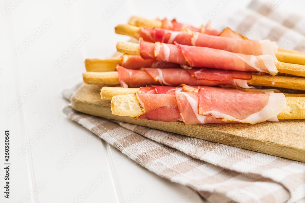 Parma ham prosciutto with grissini breadsticks. Parma ham prosciutto with grissini breadsticks.