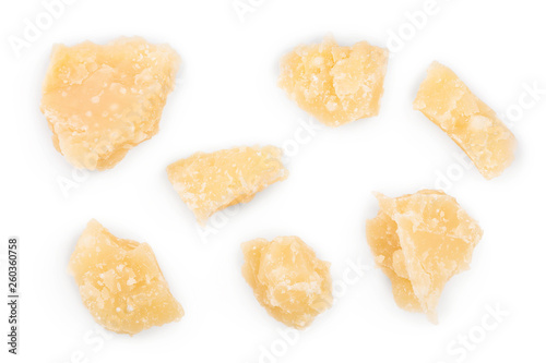 Parmesan cheese pieces isolated on white background. Closeup. Top view. Flat lay