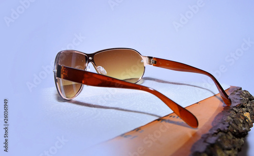 Sunglasses on a blue white background