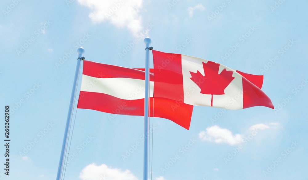Austria and Canada, two flags waving against blue sky. 3d image