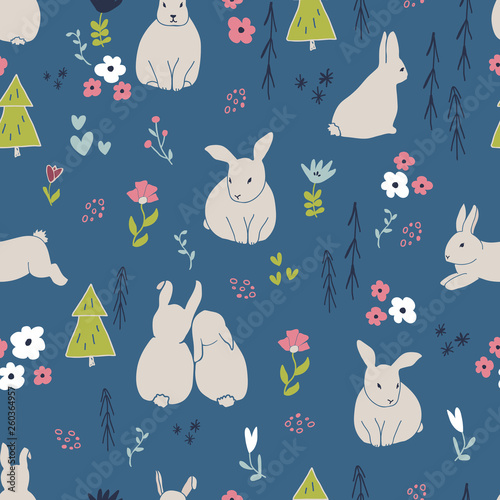 Cute rabbits and flowers seamless pattern. Spring and easter theme seamless background for nursery, baby and kids products, fabric, stationery, textile © saltoli