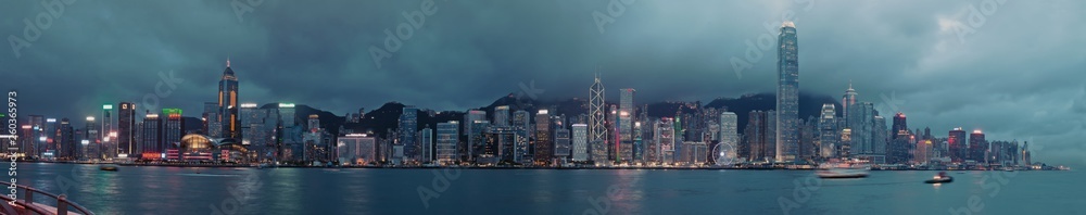 Panorama of Hong Kong City skyline  at night at taipan at typhoon . View from across Victoria Harbor HongKong
