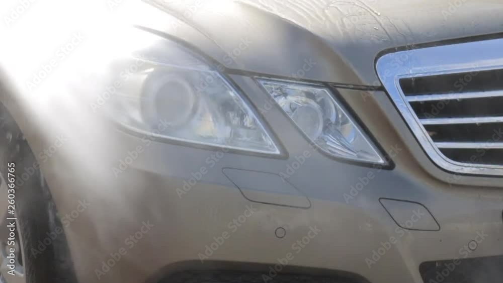 contactless washing of car headlights under pressure contactless washing of car headlights under pressure