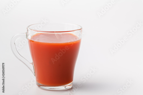 Fresh tomato juice in glass. Vegetable drink from organic natural tomato
