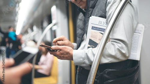 Man using mobile phone in the metro train