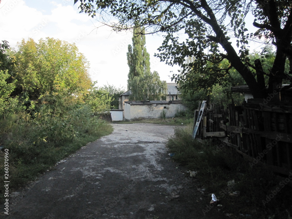 Poor condition of the road surface on narrow streets in a ukrainian city