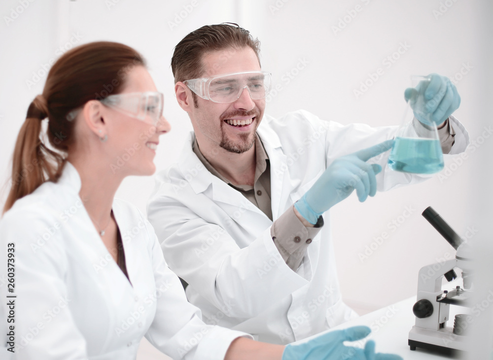 close up.two scientists discuss the results of testing. close up.two scientists discuss the results of testing.