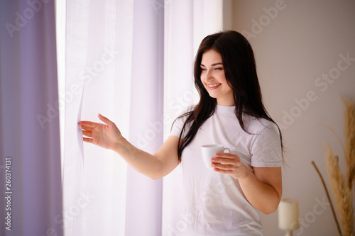 woman enjoying a cup of coffee in early morning