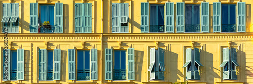     Nice in France, colorful facade, with typical murals windows and green shutters, place Garibaldi, detail 