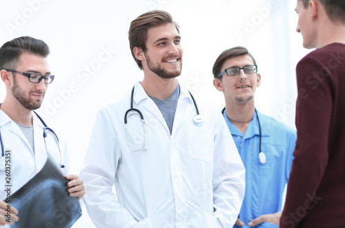 group of doctors discussing a patient's x-ray